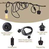 Lighting components including a light socket, wire, switch, and plug on a beige background.